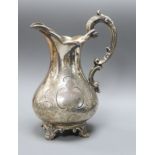 A Victorian engraved silver pear shaped cream jug, William Smily, London, 1856, 17cm, 7.5 oz.