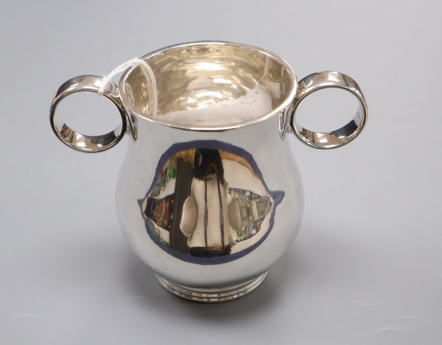 A late Victorian silver two handled loving cup, Josiah Williams & Co, London, 1890, height 10.1cm,