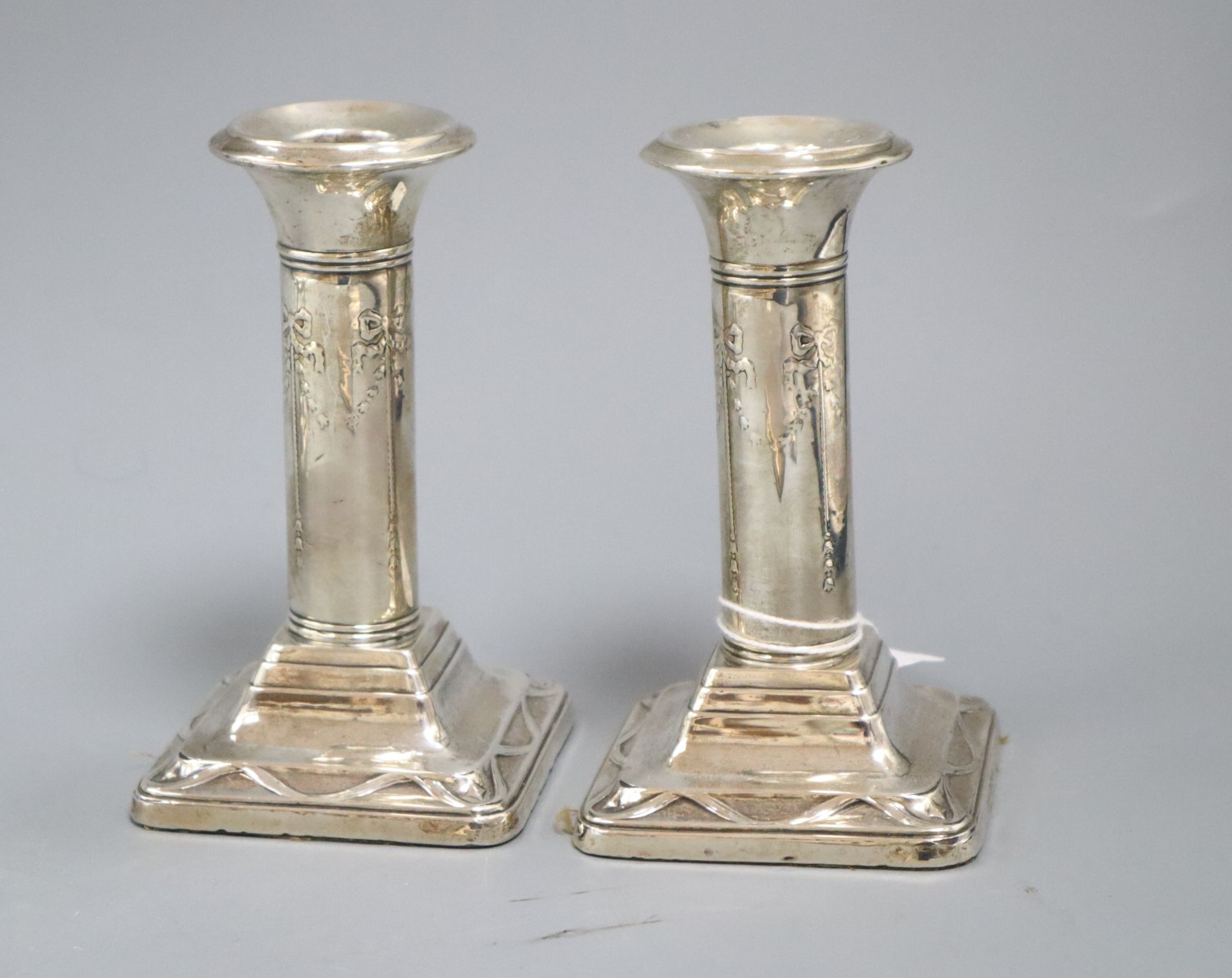 A pair of George V dwarf silver column candlesticks, Ellis & Co, Birmingham, 1924, 12.5cm.