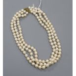 A triple strand cultured pearl necklace with 375 yellow metal clasp, approximately 46cm.