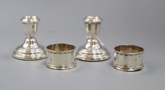 A pair of modern silver dwarf candlesticks, London, 1984 and a pair of silver salts.