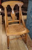 A Victorian caned beech rocking chair