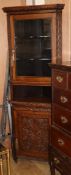 A late Victorian carved oak standing corner cupboard W.72cm