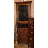 A late Victorian carved oak standing corner cupboard W.72cm