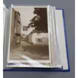 A collection of Edwardian and later postcards of Alfriston views, a stamp album and a collection