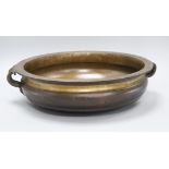 An Uruli bronze 19th century temple bowl length handle to handle 44cm