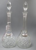 A pair of Bohemian glass decanters with two 19th century silver labels, "Sherry" and "Whiskey"