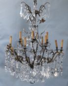 An Italian bronze and cut glass twelve light chandelier, overall drop 4ft., diameter 3ft