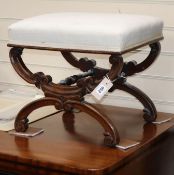 A pair of Victorian rosewood 'X' framed dressing stools