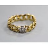 An 18ct gold curblink and diamond set ring, size size N.