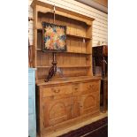 A 19th century pine dresser with boarded rack W.136cm