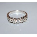 An 18ct white gold and five stone diamond half hoop ring, size N.