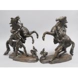 A pair of bronze Marly horses, signed Coustou height 27cm