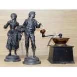 A near-Eastern copper amphora and a Victorian coffee grinder and a pair of spelter figures