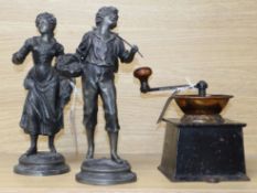 A near-Eastern copper amphora and a Victorian coffee grinder and a pair of spelter figures