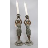 A pair of spelter Egyptian figural candlesticks height 38cm