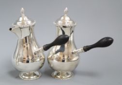 A pair of late Victorian silver cafe au lait pots and matching sugar bowl, by John Newton Mappin,