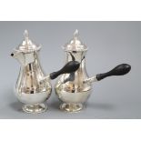 A pair of late Victorian silver cafe au lait pots and matching sugar bowl, by John Newton Mappin,