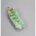 A yellow metal mounted carved jadeite pendant, 41mm.
