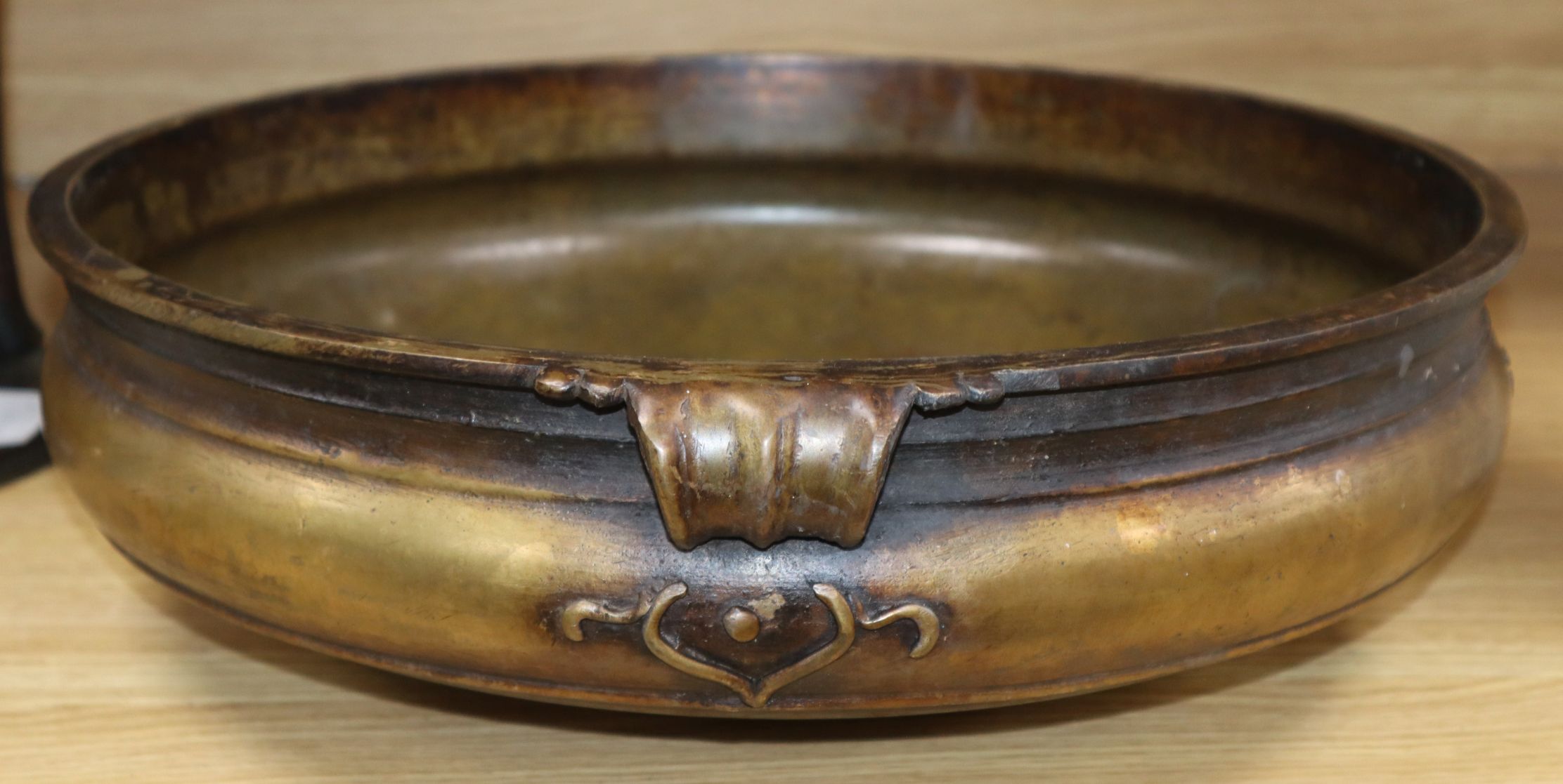 A Uruli bronze 19th century temple bowl handle to handle 45cm