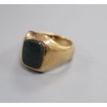 A 9ct gold and bloodstone set signet ring, size S/T.