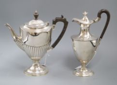 Two early 20th century silver vase shaped pedestal coffee/hot water pots including demi-fluted,