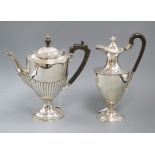 Two early 20th century silver vase shaped pedestal coffee/hot water pots including demi-fluted,