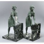 A pair of Art Deco green patinated spelter and marble figure bookends