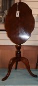 A Victorian mahogany shaped oval tilt top wine table W.51cm