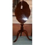 A Victorian mahogany shaped oval tilt top wine table W.51cm