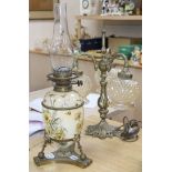 A Victorian brass and ceramic oil lamp and a cast gilt metal three light table lamp