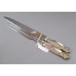 A Georg Jensen sterling handled acanthus pattern carving knife and fork, knife 34.6cm.