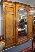 A late Victorian Aesthetic movement pollard oak three section wardrobe W.220cm