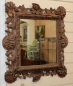 A Continental carved wood wall mirror H.66cm