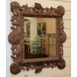 A Continental carved wood wall mirror H.66cm