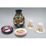 A Moorcroft vase, a pair of dwarf candlesticks and four pin dishes