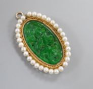 A 14k mounted jadeite and cultured pearl set oval pendant brooch, 5cm.