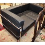 A Corbusier style black leather and chrome two seater sofa W.128cm