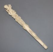 A 19th century Dieppe carved ivory parasol handle length 27.5cm