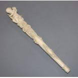 A 19th century Dieppe carved ivory parasol handle length 27.5cm