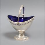 An Old Sheffield plate boat shaped pedestal sugar bowl, with swing handle