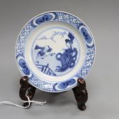 A Chinese blue and white 'boy and lady' dish, Kangxi, with stand diameter 10cm