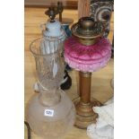 A brass and pink opaline glass oil lamp with etched glass shade and three table lamps, various,