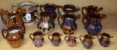 A group of Staffordshire copper lustre jugs