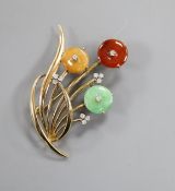 A modern 14k yellow metal, three colour jade and diamond set floral spray brooch, 47mm.