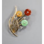 A modern 14k yellow metal, three colour jade and diamond set floral spray brooch, 47mm.