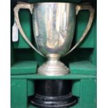 An Art Deco silver trophy cup, by Edward Barnard & Sons Ltd, London, 1932, 22.5oz, in bespoke wooden