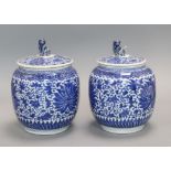 A pair of Chinese blue and white jars and covers, 19th century height 20cm
