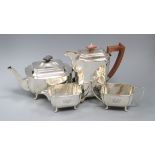 A George VI three piece silver tea set, Sheffield, 1946 and similar silver hot water pot, gross 61.5