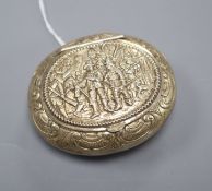 An early 20th century embossed silver gilt oval tobacco box, 80mm.
